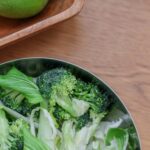 green vegetable on white ceramic plate