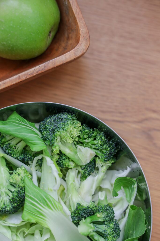 green vegetable on white ceramic plate