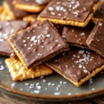 Plate of Cheez It peanut butter and chocolate treats garnished with sea salt.