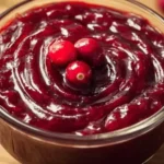 Delicious homemade cranberry sauce served in a bowl with fresh cranberries