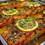 Sheet pan lemon garlic butter salmon with herbs and vegetables