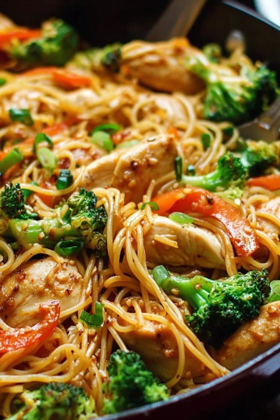 Chicken Stir Fry Noodles 3 Chicken stir fry noodles with colorful vegetables in a savory sauce