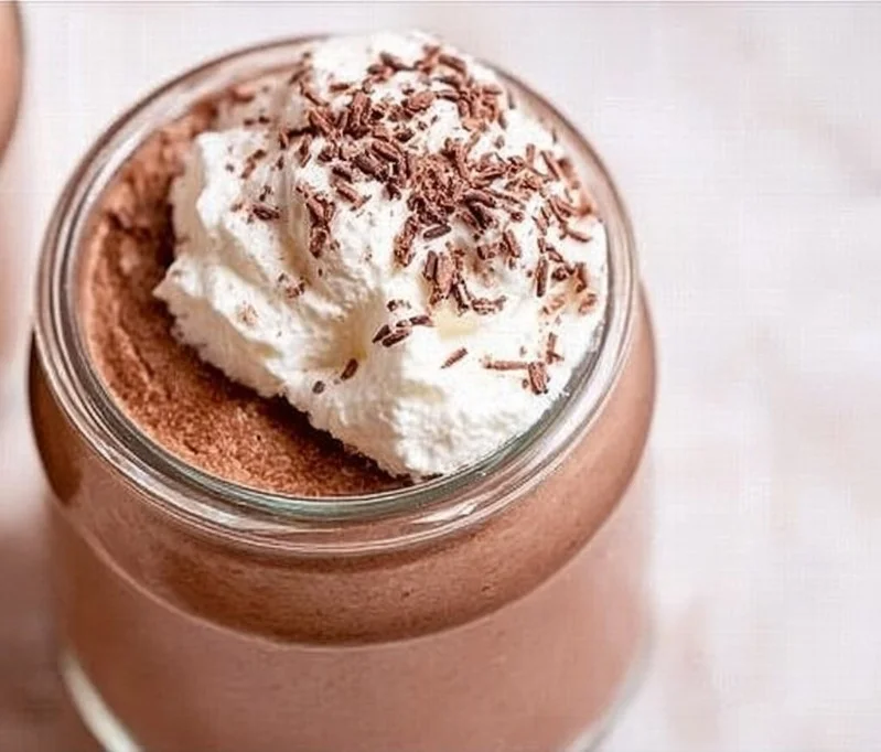 Chocolate Mousse (No Eggs) 3 A luscious bowl of eggless chocolate mousse topped with whipped cream and chocolate shavings.