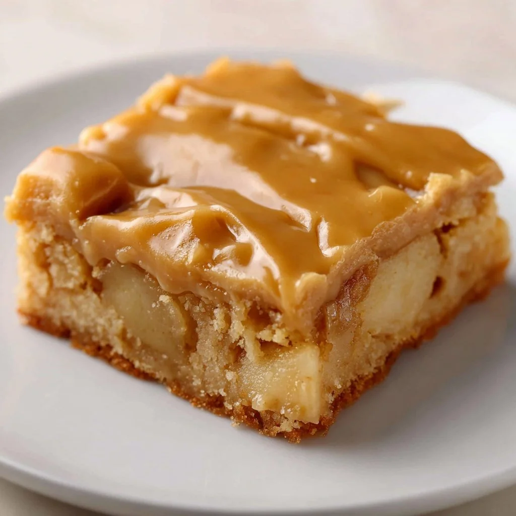 Salted Caramel Apple Sheet Cake 3 Slice of salted caramel apple sheet cake with caramel drizzle and apple slices