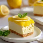 Delicious no-bake vegan lemon cheesecake bars topped with fresh lemon zest.