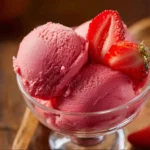 Bowl of homemade easy 3 ingredient strawberry sorbet with fresh strawberries