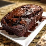 Delicious hot fudge brownie bread slice with chocolate drizzle.